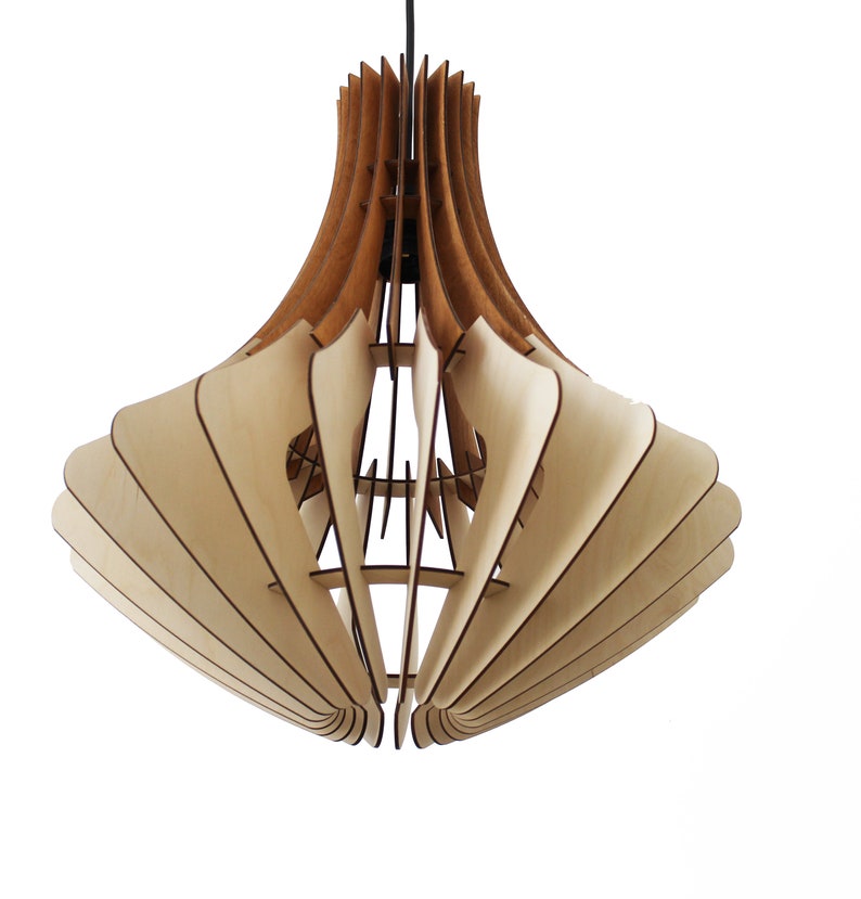 May include: A modern, geometric pendant light fixture made of layered wood. The light features a natural wood color with a darker brown accent at the top. The design is open and airy, with a unique, artistic shape.