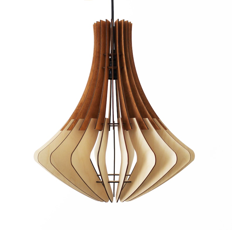 May include: A modern pendant light fixture with a layered design. The light features alternating wooden panels in light and dark brown tones, creating a unique, geometric shape. The fixture hangs from a black cord.