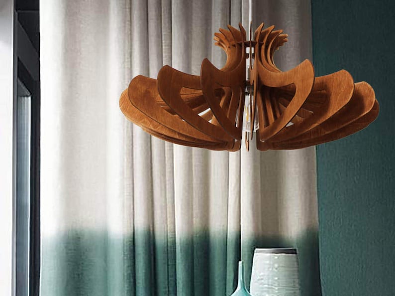 May include: A wooden ceiling light fixture with a unique, geometric design. The light fixture is made of multiple layers of wood that are arranged in a circular pattern. The light fixture is hanging from the ceiling and is illuminated by a light bulb.