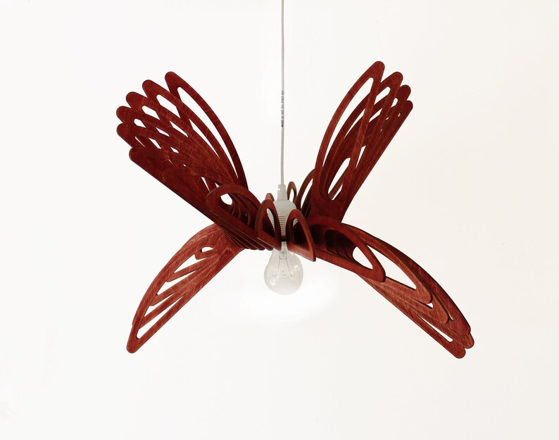 May include: A red wooden pendant light shaped like a butterfly with a single light bulb in the center.