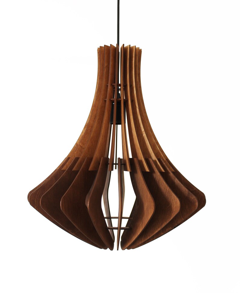 May include: A wooden pendant light fixture with a unique, layered design. The fixture is made of multiple curved wooden slats, creating a flared shape. The wood has a warm, natural tone, and the light hangs from a black cord.