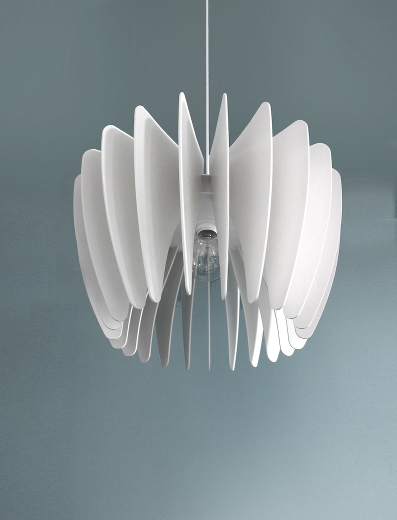 May include: White ceiling light fixture with a modern design. The light fixture is made of multiple thin, white, curved panels that create a flower-like shape.