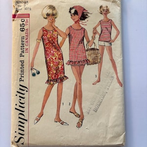 May include: A vintage Simplicity sewing pattern envelope, number 5974, for a junior size 9 with a 30.5 inch bust. The front features illustrations of three outfits: a floral shift dress, a red and white gingham dress, and a striped tank with shorts.