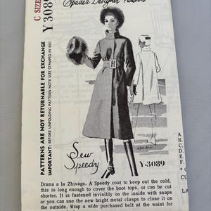 May include: A Spadea Designer Pattern Y 3089 envelope featuring a black and white illustration of a long coat with a belt, worn with tall boots and a fur hat. The text includes C SIZE 12, Y 3089, Sew Speedy, and descriptive text about the coat design.