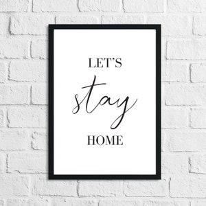Op de afbeelding: Zwart-witte printbare wandkunst met de tekst "Let's stay home".