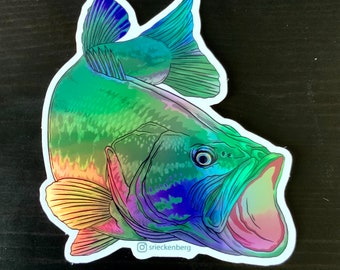 May include: Holographic sticker of a largemouth bass with an open mouth. The fish is depicted in shades of green, blue, purple, and yellow, with a white outline. The artist's name, srieckenberg, is in the bottom right corner.