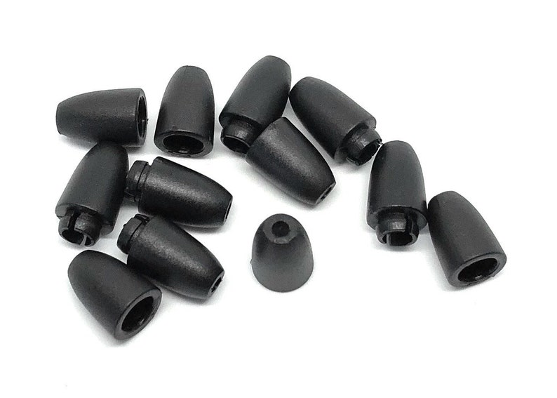 May include: A collection of black cord end caps, also known as cord locks, displayed against a white background. These small, cone-shaped plastic pieces have a hollow interior and are designed to secure cords.