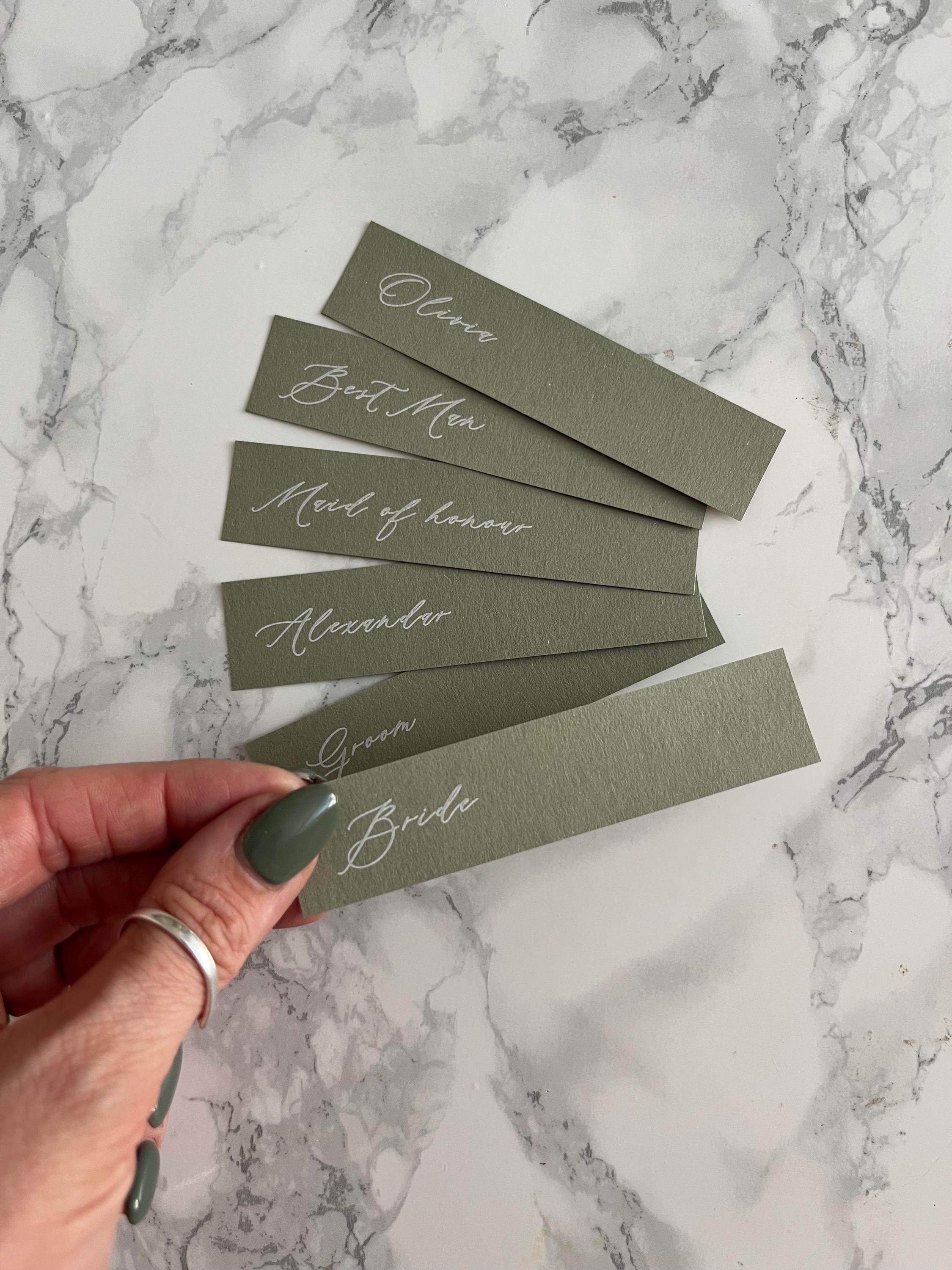 Sage green place cards with white ink