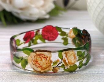 English rose bangle. See-through, unique, entirely made and shaped by hand. Made in UK.