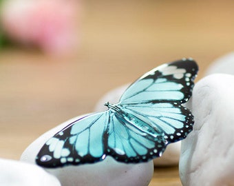 Baby blue butterfly brooch, made by hand in England. Transparent resin brooch.