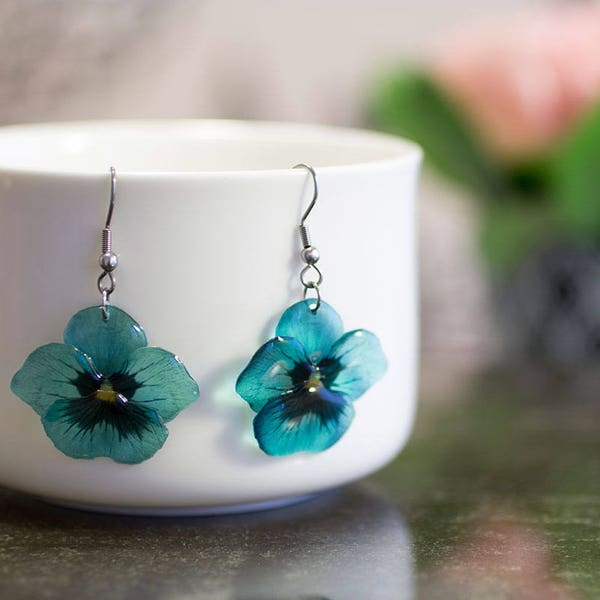 Teal pansy flower earrings. Comes in a gift box.