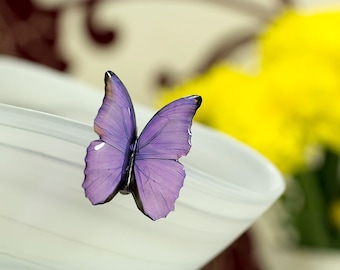 Purple small butterfly brooch. Looks like real blue morpho butterfly. Comes in a jewllery box.