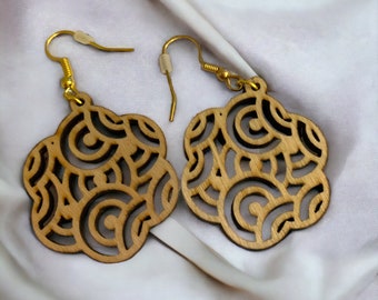 Wooden dangle earrings, made on a laser burning machine, you are sure to make a statement with these.