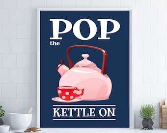 May include: A white framed poster with a blue background and white text that says "POP the KETTLE ON". A pink teapot and a red teacup with white polka dots are in the center of the poster.