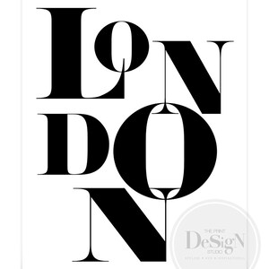 May include: Black and white graphic design print with the word "LONDON" in bold, stylized lettering. The print includes the text "The Print Design Studio" in a smaller font.