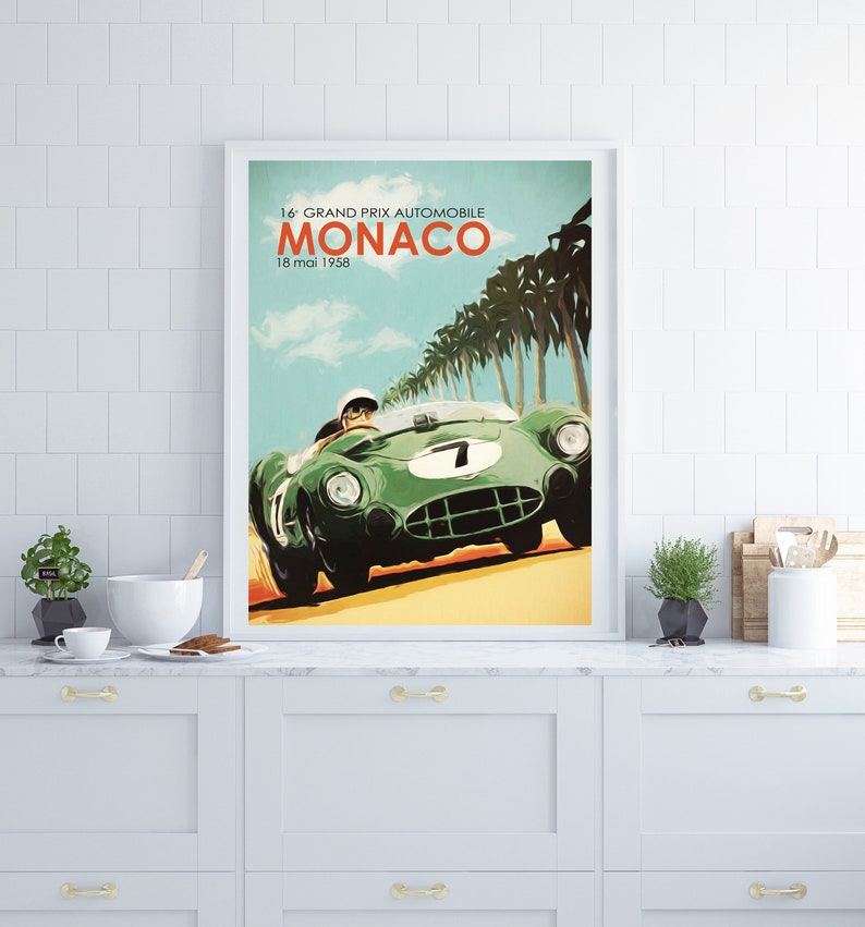 May include: A vintage poster advertising the 16th Grand Prix Automobile Monaco, held on May 18, 1958. The poster features a green race car with a driver in a white helmet, speeding down a road lined with palm trees.
