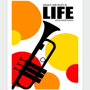 May include: A black trumpet with a red, orange, and yellow circle pattern in the background. The text "WHAT WE PLAY IS LIFE" and "LOUIS ARMSTRONG" is printed in black.