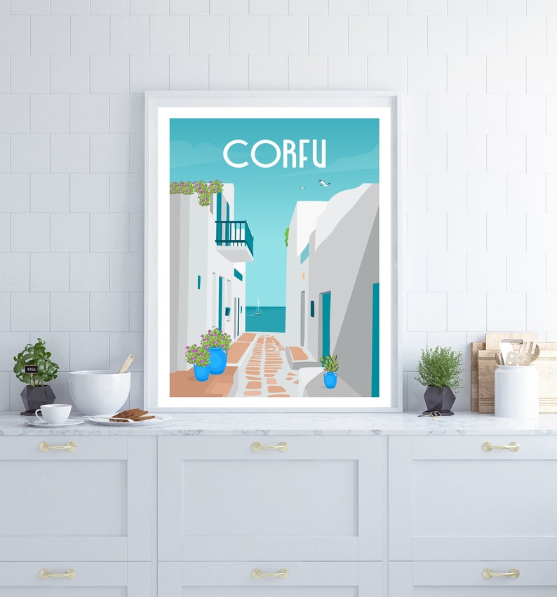 May include: A white framed poster with a blue and white illustration of a narrow street in Corfu, Greece. The street is lined with white buildings and has a blue tiled walkway. The text "CORFU" is printed in white at the top of the poster.