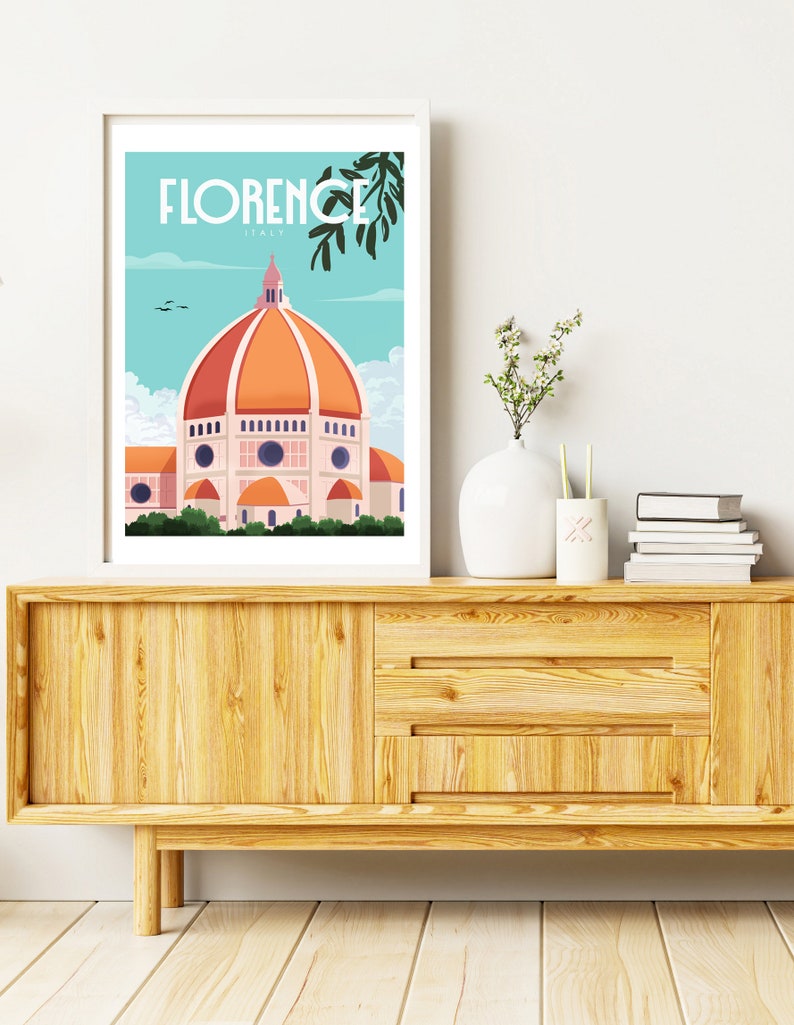 Może przedstawiać: Biały plakat w ramie z niebieską i pomarańczową ilustracją Duomo we Florencji we Włoszech. Plakat zawiera tekst "FLORENCE ITALY" u g&oacute;ry.