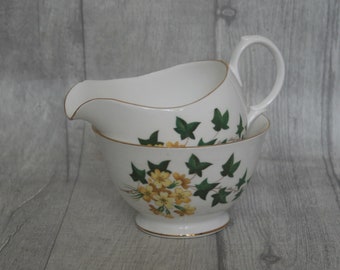 Gainsborough sugar bowl and milk jug with yellow flower design. Made in England. Bone China