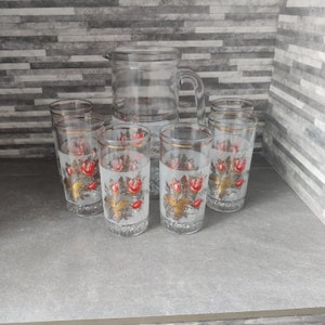 Glass Jug / Pitcher and 6 matching glasses