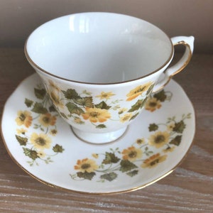Queen Anne Yellow Flower Teacup and Saucer. Home decor.