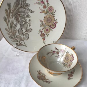 Porcelain trio, teacup and saucer and tea plate with painted flowers and golden rims. Made by Bareuther Waldsassen Bavaria