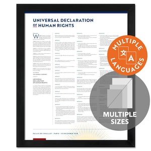 May include: A framed print of the Universal Declaration of Human Rights, with text in multiple languages. The print is in a black frame and includes a graphic indicating multiple sizes. The text includes the date and location of the declaration.