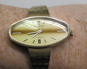 Antique Ladies Helbros 1970's Wrist Watch Yellow base Metal, 17 jewels. Very cool shape wrist watch.