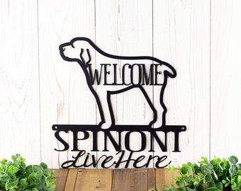 May include: Black metal sign with a silhouette of a Spinoni dog and the text "Welcome Spinoni Live Here".