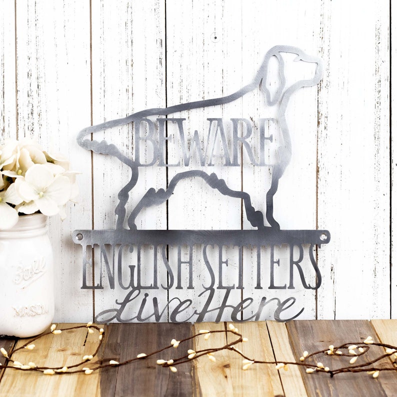 English Setters Live Here metal wall art with Beware, in raw steel.