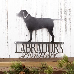 Labradors Live Here metal sign, in raw steel.