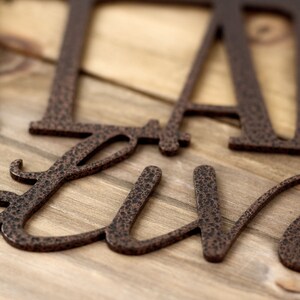 Close up of copper vein powder coat on our Labradors Live Here metal wall art.