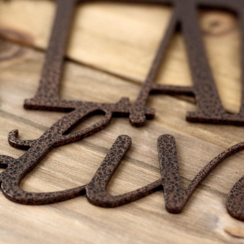 Close up of copper vein powder coat on our Labradors Live Here metal wall art.