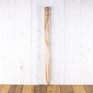 Wooden stake point with screws.
