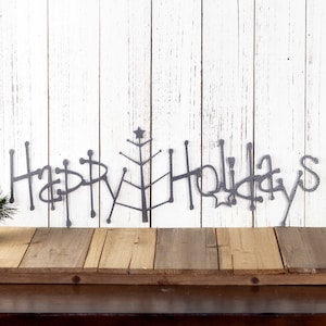 Happy Holidays metal wall art with Christmas tree, in silver vein powder coat.