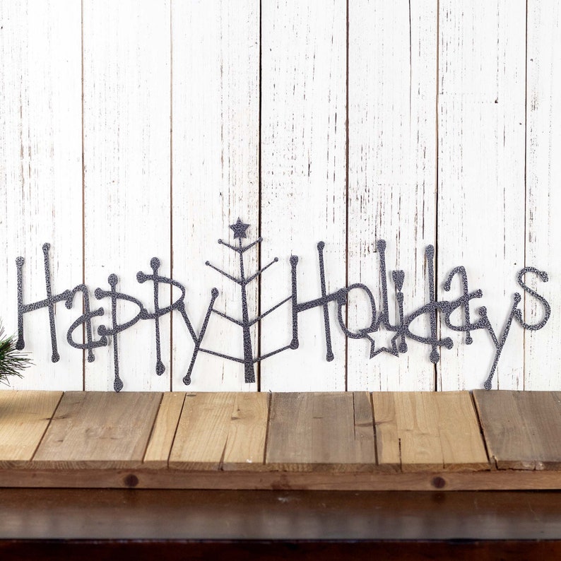Happy Holidays metal wall art with Christmas tree, in silver vein powder coat.