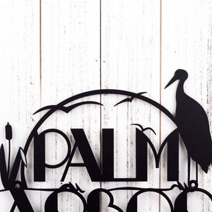 Close up of modern lettering on our lake house name sign, in matte black powder coat.