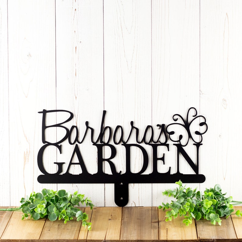 Personalized garden sign with first name and butterfly, in matte black powder coat.