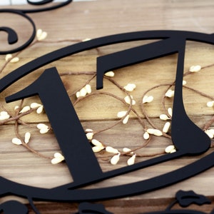 Close up of 2 digit metal house number on our metal address plaque, in matte black powder coat.