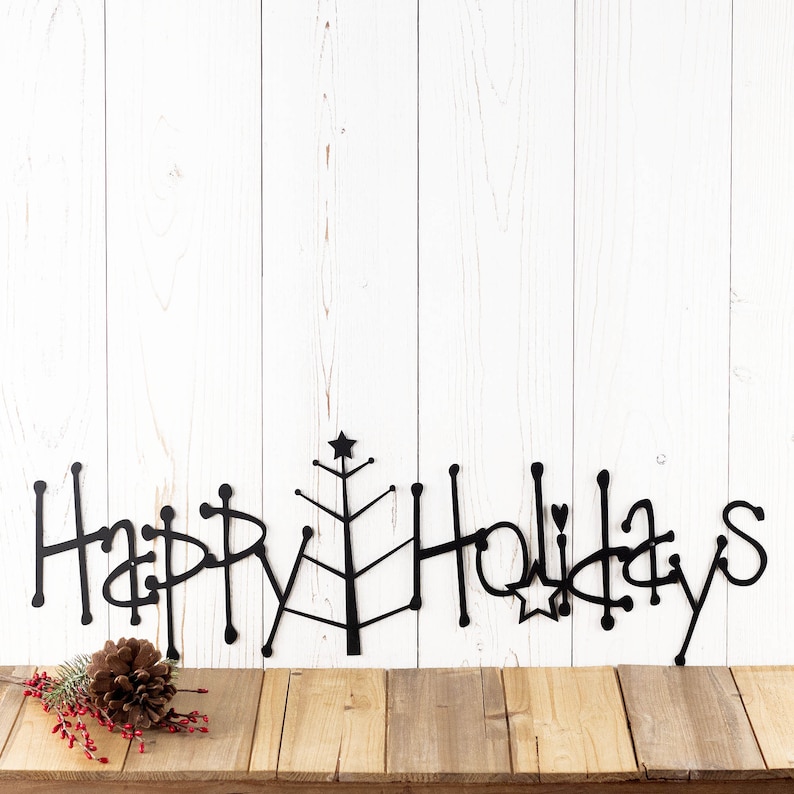 Happy Holidays metal wall art with Christmas tree, in matte black powder coat.