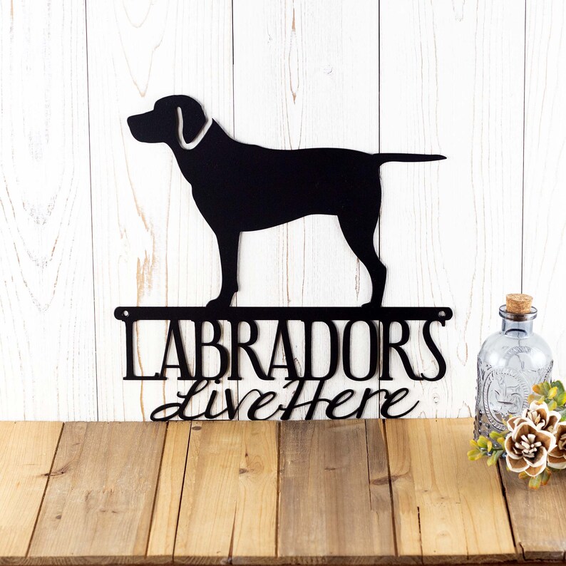Labradors Live Here metal sign, in matte black powder coat.
