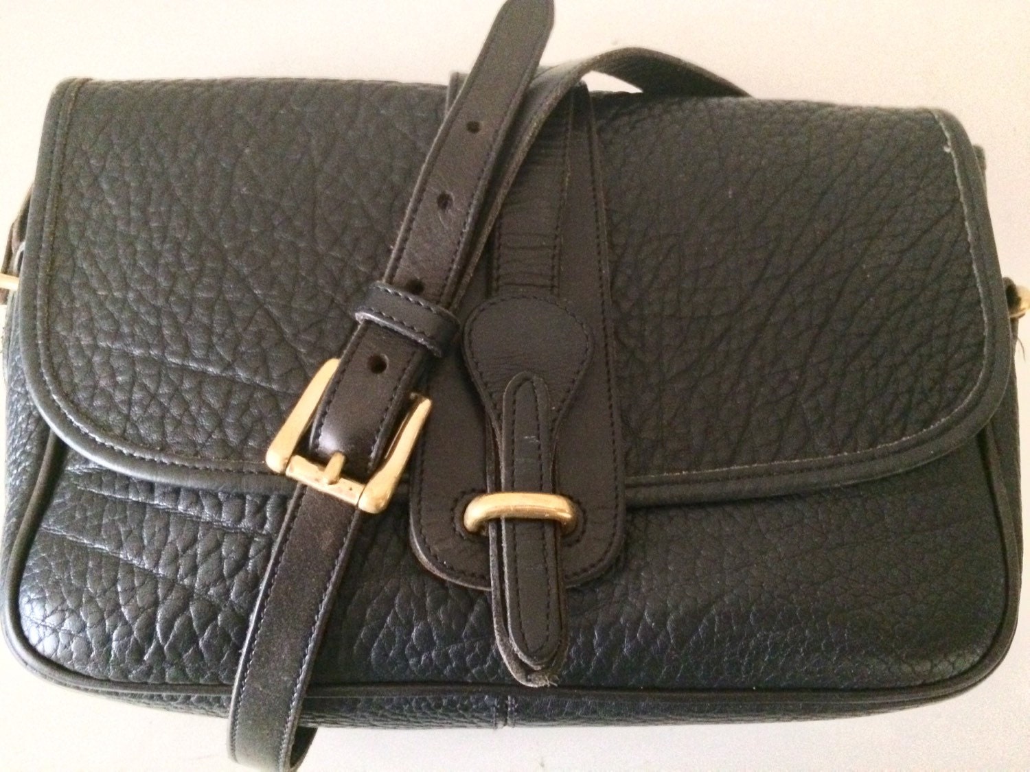 Dooney & Bourke AWL navy and tan equestrian tack crossbody bag