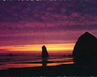 Oregon: Vintage Postcard of Haystack Rock in Cannon Beach at Sunset. This Vintage Oregon Coast Postcard is Circa the 1970's.