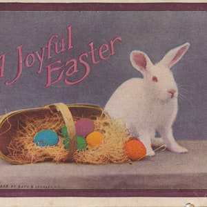 Pâques : carte postale de Pâques antique intemporelle de 1915 avec un lapin blanc et des œufs colorés - un trésor vintage !