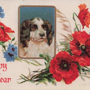 "Neues Jahr: Charmante antike ""A Happy New Year"" Postkarte mit Hund und lebendigem Blumenmuster - Vintage Ephemera aus den 1910er Jahren."