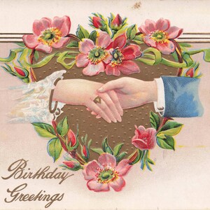 Aniversário: Cartão postal antigo de felicitações de aniversário com aperto de mão e design floral - início dos anos 1900