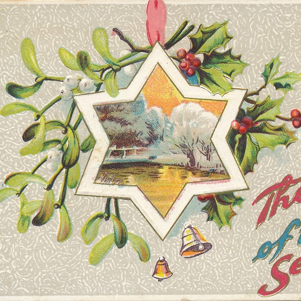 Noël : carte postale ancienne de 1911 Les joies de la saison avec une belle décoration d'étoile parmi le houx et le gui.