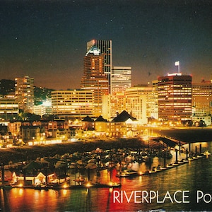 Oregon: Vintage Postcard of Riverplace Marina and the Willamette River at Night in Portland Oregon. This Oregon Postcard is Circa 1988.