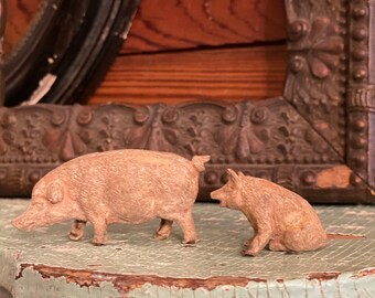 Antique  composition pigs